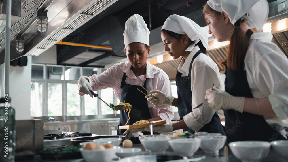 Chef In Training Chef in the kitchen provides cooking training to students.Schoolgirls ...