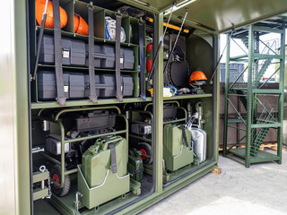 Rescuers equipment. Racks with devices for rescuers. Equipment for emergency services. Metal container with canisters and cases for rescuers. Instrumentation for rescue services staff.