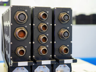 Poster - electrical equipment. electrical equipment with many connectors. three black appliances close-up. bl