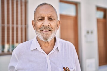 Canvas Print - Senior man smiling confident at street