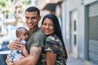 © Krakenimages.com - Hispanic family smiling confident hugging each other at street