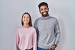 © Krakenimages.com - Young hispanic couple standing together with a happy and cool smile on face. lucky person.