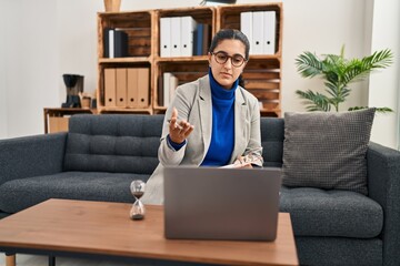 Canvas Print - Young hispanic woman having online psychology session at clinic