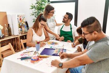 Sticker - Group of draw students sitting on the table drawing at art studio.