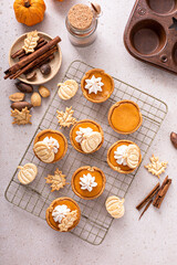 Wall Mural - Mini pumpkin pies with wipped cream and cinnamon