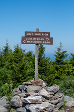 Sign And Cairn At Hiking Trail Intersection