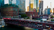 Chicago, IL USA September 1 2022: establishing aerial drone footage of  the Chicago downtown  train over the lake water during sunset. the city always moving during the course of the day