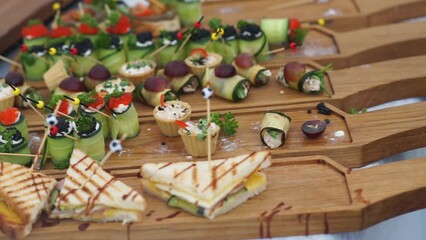 Wall Mural - canapes and other snacks made of fresh bread are on the buffet table for the guests of the event