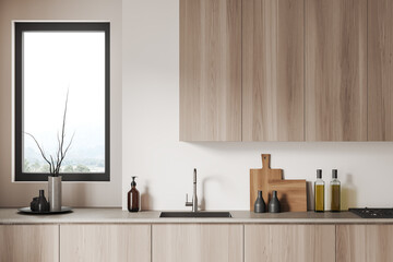 Light kitchen interior with shelves and kitchenware, cooking area and window