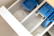 © Ardi - washing powder in the compartment of the washing machine