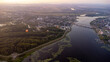 Drone aerial view of hot air balloons over the Volga river in the Kostroma region at sunset. travel background