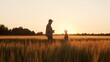 Farmer and his son in front of a sunset agricultural landscape. Man and a boy in a countryside field. Fatherhood, country life, farming and country lifestyle.