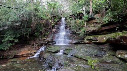 Canvas Print - A beautiful small waterfall in the forest.