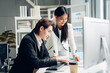 © kelvn - Successful business team working together in a co-working office