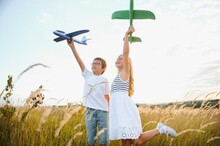 Children Play Toy Airplane. Concept Of Happy Childhood. Children Dream Of Flying And Becoming A Pilot.