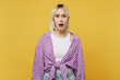 Young shocked astonished sad scared blonde woman 20s she wear pink tied shirt white t-shirt look camera with opened mouth isolated on plain yellow background studio portrait. People lifestyle concept.