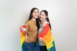 © Pormezz - lesbian gay lover couple holding a gay flag isolated on background banner size