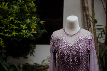 Detail Dress. Purple Wedding Dress On A Mannequin.