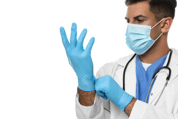 Wall Mural - Doctor in protective mask putting on medical gloves against white background