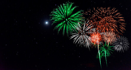 Wall Mural - red and green with white firework in dark night background.