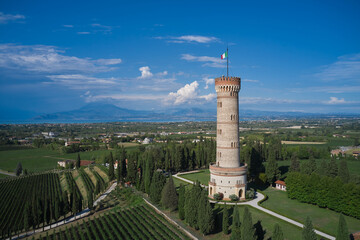 Tower of San Martino della Battaglia aerial view. Italian vineyards aerial view. Aerial panorama view of the Tower of San Martino della Battaglia, Lake Garda, Italy. High round tower on Lake Garda.