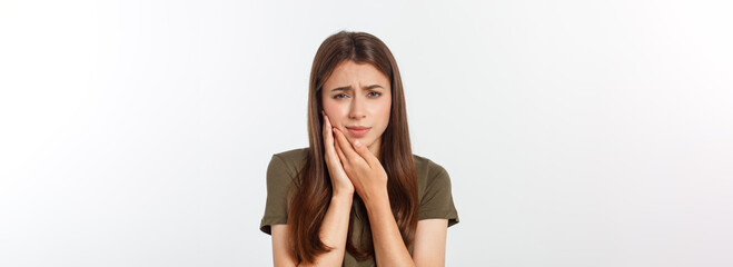 Teen woman pressing her bruised cheek with a painful expression as if she is having a terrible tooth ache