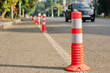 © Oleg Kozlovskiy - Anti-parking traffic cones on a bicycle path. Close-up, selective focus.