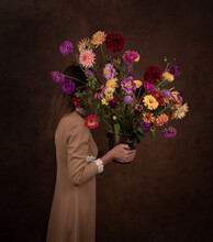 Renaissance Portrait Of Woman Holding A Colorful Bouquet Of Dahlia And Zinnia Flowers