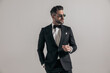 © Viorel Sima - elegant businessman in tuxedo with hand in pocket looking to side