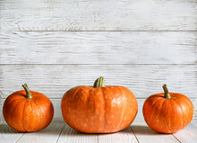 Pumpkins On Wood White Texture Background For Halloween Theme