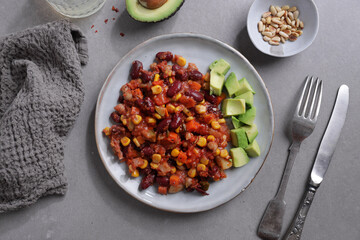 Sticker - Chili con carne with avocado served on plate