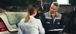 © chokniti - mechanic technician making handshake deal with business customer at auto car garage service, workshop occupation for automobile maintenance repair, adult industry worker greeting for client agreement