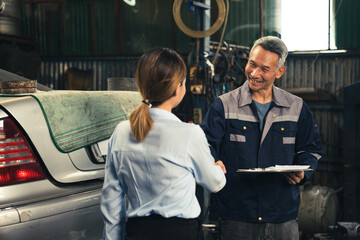 mechanic technician making handshake deal with business customer at auto car garage service, workshop occupation for automobile maintenance repair, adult industry worker greeting for client agreement