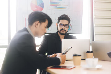 Wall Mural - Focus on business man with bread expland financial plans or teach for team employee in office