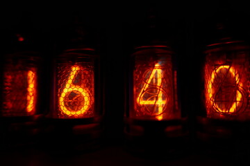 Poster - Retro Nixie lamp indicator clock on dark background. The Nixie tube indicator of the numbers of retro style.