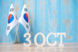 Wooden text of October 3rd with Republic of Korea flags. National Foundation Day, Gaecheonjeol, public Nation holiday Day and happy celebration concepts