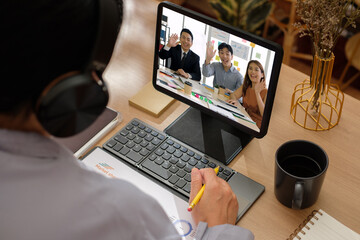 Wall Mural - asian woman video conference business meeting with colleage online with tablet at home