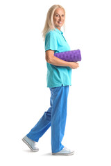 Poster - Mature physiotherapist with foam roller on white background