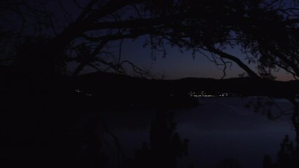 Wall Mural - Panning Scenic View Of Mountains And Lake At Night - Bellevue, Washington