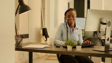 Poster - Portrait of businesswoman using computer at company desk, working on research data and paperwork. Analyzing online information to do report and take notes, sending executive email.