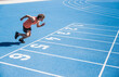 © Westend61 - Young athlete running on track