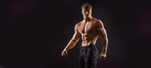  The Torso Of Attractive Muscular Male Body Builder On Black Background.