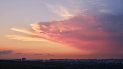 Wall Mural - Big clouds in the red sunset sky. Evening sky in bright sunlight
