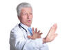 © aletia2011 - portrait of  senior male doctor with stethoscope is afraid