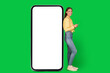 © Prostock-studio - Lady Using Phone Near Big Cellphone Screen Over Green Background