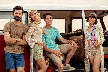 Canvas Print - Photo of pretty adorable hippie people company riding retro van together smiling outside seaside beach