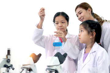 students and teacher in lab coat have fun together while learn science experiment in laboratory. you