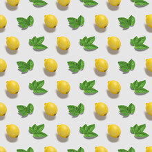 Fresh Ripe Fruits On Color Background. Pattern With Lemon And Mint Leaves  On White Background . Top View. Pop Art Design, Creative Summer Food Concept.