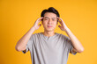 © 1112000 - Asian young man posing on a yellow background