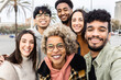© Xavier Lorenzo - Multiracial group of young friends taking selfie portrait together outdoor - Millennial diverse people laughing and having fun enjoying free time in city street - Friendship and youth concept